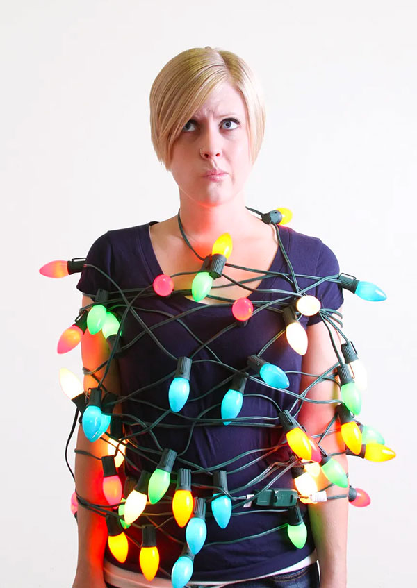 Woman Tangled in Christmas Lights