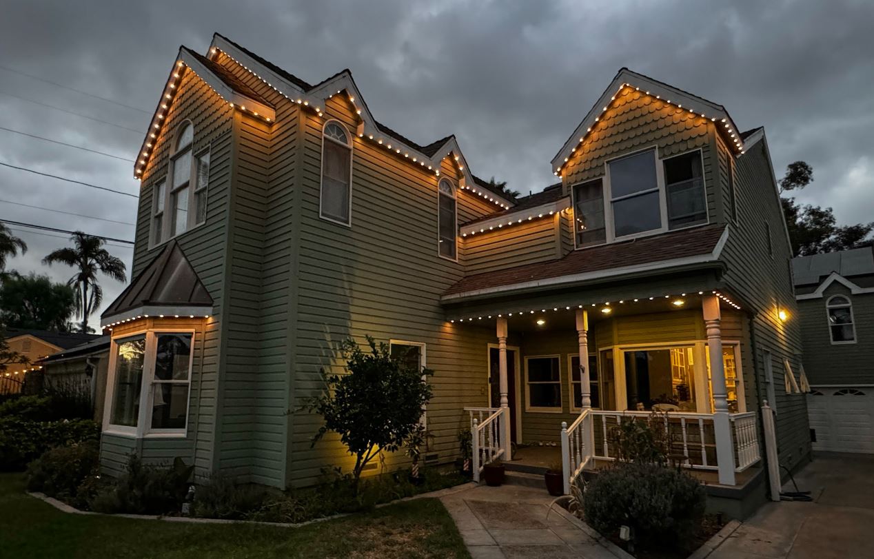 victorian home with permanent outdoor lighting